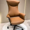 Experience unmatched executive comfort with the Luxury Ergonomic Executive Boss Chair, a premium seating solution designed for senior professionals who demand superior support, sophisticated aesthetics, and long-lasting performance. Featuring an elegant extra-high backrest with a sculpted ergonomic profile, this chair delivers exceptional support to the neck, shoulders, and spine during extended working hours. The generously cushioned seat and backrest are upholstered in premium-quality material that offers a soft, luxurious feel while enhancing the visual appeal of executive interiors. The integrated ergonomic headrest provides enhanced neck comfort, while the wide padded armrests support relaxed arm positioning and reduce shoulder fatigue. Built for professional performance, this executive chair includes a smooth height-adjustable mechanism, 360-degree swivel functionality, and durable caster wheels for effortless mobility. The designer metal base ensures excellent stability, strength, and long-term durability, making it suitable for daily commercial office use. Its bold contemporary design and luxury finish make this chair an outstanding choice for executive cabins, CEO offices, director rooms, boardrooms, premium workstations, and luxury home offices. Key Features Extra-high ergonomic executive backrest Sculpted integrated headrest for neck support Premium upholstered cushioning Wide padded armrests for superior comfort Thick seat cushioning for long working hours 360° swivel functionality Height-adjustable seating mechanism Designer heavy-duty metal base Smooth rolling caster wheels Strong and stable construction for executive use Ideal For CEO offices Director rooms Executive cabins Corporate offices Boardrooms Premium workstations Luxury home offices SEO Keywords Luxury executive chair, boss chair, ergonomic executive office chair, high back office chair, CEO chair, director office chair, premium office chair, luxury boss chair, executive swivel chair, upholstered executive chair, modern corporate office chair, designer office chair.