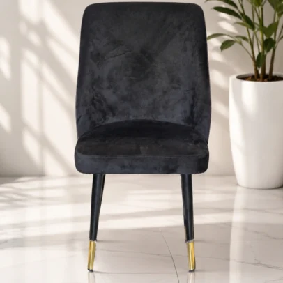 Premium Upholstered Visitor Chair with Metal Legs for Reception, Meeting & Waiting Areas Enhance your office interiors with the Premium Upholstered Visitor Chair with Metal Legs, a stylish and comfortable seating solution designed for modern commercial and residential spaces. Combining elegant upholstery, ergonomic comfort, and a durable metal frame, this chair is ideal for reception areas, visitor lounges, conference rooms, executive offices, cafés, hotels, restaurants, and waiting areas. Designed with a clean, minimalist silhouette, the chair features a generously padded seat and backrest upholstered in premium velvet fabric. The soft-touch upholstery provides exceptional comfort while adding a sophisticated and luxurious appearance to any environment. Its ergonomic backrest supports the natural posture of the user, making it suitable for extended seating during meetings, discussions, or waiting periods. The chair is built on a heavy-duty powder-coated metal frame, ensuring excellent strength, stability, and long-lasting durability. The elegant black-finished legs are complemented with premium gold-finish metal caps, creating a luxurious contemporary look that blends perfectly with modern office interiors, hospitality spaces, and designer furniture collections. High-density foam cushioning offers outstanding seating comfort while maintaining its shape even after prolonged daily use. The premium upholstery is durable, easy to maintain, and resistant to everyday wear, making it suitable for high-traffic commercial environments. Whether placed in a corporate reception, executive cabin, conference room, hotel lobby, café, restaurant, boutique, or modern home office, this visitor chair provides a perfect combination of comfort, elegance, and functionality. Its compact footprint allows efficient space utilization while delivering premium seating for guests and clients. Manufactured using high-quality materials and precision craftsmanship, this chair is engineered for commercial-grade performance. Anti-slip leg protectors improve stability and help protect flooring from scratches, ensuring reliable everyday use. The Premium Upholstered Visitor Chair with Metal Legs is an excellent choice for businesses seeking premium visitor seating that reflects professionalism and modern design. Its timeless aesthetics and durable construction make it a valuable addition to any contemporary workspace. Key Features Premium Velvet Upholstery Ergonomic Backrest Design High-Density Foam Cushion Heavy-Duty Metal Frame Powder-Coated Black Legs Decorative Gold Metal Leg Caps Modern Contemporary Styling Durable Commercial-Grade Construction Comfortable for Extended Sitting Scratch-Resistant Frame Anti-Slip Floor Protectors Easy to Clean & Maintain SEO Keywords Visitor Chair Upholstered Visitor Chair Reception Chair Office Visitor Chair Conference Chair Waiting Room Chair Velvet Visitor Chair Guest Chair Reception Seating Metal Leg Visitor Chair Modern Office Chair Executive Visitor Chair Commercial Seating Chair Office Furniture Lounge Chair