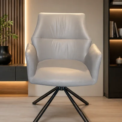 Premium Swivel Conference Chair with Upholstered Seat for Meeting Rooms, Offices & Executive Spaces Upgrade your meeting and executive spaces with the Premium Swivel Conference Chair with Upholstered Seat, a perfect combination of contemporary design, ergonomic comfort, and commercial-grade durability. Designed for conference rooms, executive cabins, meeting areas, reception lounges, and modern office interiors, this stylish chair delivers exceptional seating comfort while enhancing the professional appearance of your workspace. Crafted with a spacious ergonomic seat and supportive backrest, this conference chair provides outstanding comfort during long meetings, presentations, client discussions, and collaborative work sessions. The generously padded high-density foam cushioning reduces seating fatigue, allowing users to remain comfortable throughout extended periods of use. The chair is upholstered in premium leatherette, offering a soft-touch surface that is durable, easy to clean, and resistant to daily wear. Its elegant light grey finish complements modern office interiors, luxury conference tables, executive cabins, coworking spaces, hospitality environments, and premium commercial settings. Designed with integrated padded armrests, the chair provides additional support for the arms and shoulders, helping users maintain a relaxed and comfortable sitting posture. The ergonomic backrest naturally supports the spine while encouraging proper posture during meetings and discussions. The chair features a 360-degree swivel spider base manufactured from heavy-duty powder-coated steel, ensuring excellent stability, durability, and smooth rotational movement. The fixed four-leg swivel base offers superior balance while allowing users to rotate effortlessly without moving the chair, making communication and collaboration more convenient. Its modern minimalist design blends seamlessly with executive office furniture, boardroom interiors, reception spaces, consulting rooms, and designer work environments. The strong metal construction ensures reliable performance in high-traffic commercial applications while maintaining a sophisticated appearance. Manufactured using premium-quality materials and precision engineering, the Premium Swivel Conference Chair with Upholstered Seat is built for long-term durability and everyday professional use. Whether you are furnishing a conference room, executive office, meeting lounge, or premium reception area, this chair provides the perfect combination of comfort, elegance, and functionality. Enhance your workspace with a conference chair that reflects professionalism, modern design, and lasting quality while providing exceptional seating comfort for employees, clients, and guests. Key Features Premium Leatherette Upholstery Ergonomic Curved Backrest High-Density Foam Cushion Integrated Padded Armrests 360° Swivel Mechanism Heavy-Duty Steel Spider Base Powder-Coated Metal Frame Stable Four-Leg Design Modern Executive Appearance Commercial-Grade Construction Comfortable for Long Meetings Easy to Clean & Maintain Product Specifications Chair Type: Conference Chair Category: Conference Chairs Seat Material: Premium Leatherette Upholstery Cushion Material: High-Density Foam Back Style: Medium Back Ergonomic Armrests: Integrated Padded Armrests Base Material: Heavy-Duty Powder-Coated Steel Base Type: 4-Leg Swivel Spider Base Rotation: 360° Swivel Color: Light Grey Usage: Indoor Commercial & Residential Maintenance: Easy to Clean Ideal For Conference Rooms Boardrooms Executive Offices Meeting Rooms Reception Areas Visitor Lounges Corporate Offices Consulting Rooms Hotels Business Centers Coworking Spaces Premium Commercial Interiors Conference Chair Swivel Conference Chair Executive Conference Chair Meeting Room Chair Visitor Chair Reception Chair Upholstered Conference Chair Office Meeting Chair Modern Office Chair Executive Seating Chair Boardroom Chair Office Visitor Chair Commercial Office Chair Leatherette Conference Chair Premium Office Furniture