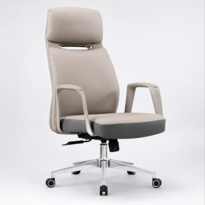 Experience superior comfort and executive elegance with the Premium High Back Executive Office Chair with Integrated Headrest, crafted for professionals who demand both style and performance. Featuring a sleek contemporary design with premium upholstery, this chair enhances the appearance of executive cabins, director rooms, corporate offices, and luxury home workspaces. The ergonomic high-back structure provides excellent support to the neck, shoulders, and lower back, helping maintain healthy posture during long working hours. The integrated cushioned headrest offers additional neck support, while the generously padded seat ensures lasting comfort throughout the day. Designed for smooth mobility and flexible movement, the chair includes a 360-degree swivel mechanism, height-adjustable seat control, and durable caster wheels. The sturdy chrome-finish metal base delivers enhanced stability and long-term durability, making it suitable for daily professional use. With its refined finish, supportive cushioning, and modern executive styling, this chair is an ideal seating solution for senior executives, directors, managers, consultants, and professionals seeking a premium office seating experience. Key Features Ergonomic high-back executive design Integrated cushioned headrest for neck support Premium upholstered seat and backrest Comfortable fixed armrests with modern styling Thick seat cushioning for extended sitting comfort 360° swivel functionality Height-adjustable mechanism Durable chrome-finish metal base Smooth rolling caster wheels Strong and stable construction for daily office use Ideal For Executive cabins Director rooms CEO and manager offices Corporate offices Boardrooms Premium workstations Luxury home offices SEO Keywords Executive office chair, high back executive chair, boss chair, luxury office chair, director office chair, manager chair, ergonomic office chair, office chair with headrest, premium executive chair, swivel office chair, cushioned office chair, modern executive seating.