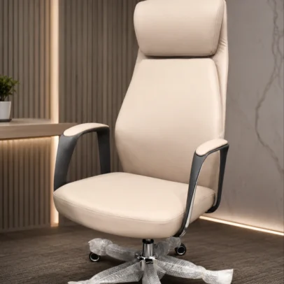 Enhance your executive workspace with the Premium Ergonomic High Back Executive Office Chair, crafted to deliver exceptional comfort, professional elegance, and long-lasting performance. Featuring a sleek high-back silhouette with integrated headrest support, this chair provides superior ergonomic comfort while complementing modern office interiors. The generously cushioned seat and backrest support the neck, shoulders, and lower back, helping maintain healthy posture and reducing fatigue during extended working hours. The integrated headrest offers enhanced neck support, while the softly padded armrests ensure relaxed arm positioning for improved productivity and comfort. Designed for everyday professional use, this executive chair includes a smooth height-adjustable mechanism, 360-degree swivel functionality, and durable caster wheels for effortless movement across office floors. The sturdy chrome-finish metal base provides excellent stability, strength, and long-term durability, making it ideal for demanding corporate environments. With its refined contemporary design and premium upholstery finish, this chair is perfectly suited for executive cabins, director rooms, boardrooms, corporate offices, premium workstations, and luxury home offices. Key Features Ergonomic high-back executive design Integrated cushioned headrest support Premium upholstered seat and backrest Comfortable padded armrests Thick cushioning for long-hour comfort 360° swivel functionality Height-adjustable seating mechanism Durable chrome-finish metal base Smooth rolling caster wheels Strong and stable construction for professional use Ideal For Executive cabins Director rooms CEO offices Manager cabins Corporate offices Boardrooms Premium workstations Luxury home offices SEO Keywords Premium executive office chair, ergonomic high back office chair, boss chair, luxury office chair, director office chair, manager chair, office chair with headrest, executive swivel chair, cushioned office chair, corporate office chair, modern executive seating, premium boss chair.