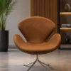 Luxury Swan Lounge Chair for Reception, Hotel Lobby & Premium Lounge Spaces Bring timeless elegance and superior comfort to your workspace with the Luxury Swan Lounge Chair. Designed with a beautifully curved shell, premium upholstery, and a heavy-duty swivel base, this chair is an excellent choice for reception areas, executive lounges, hotel lobbies, waiting rooms, luxury offices, cafés, restaurants, salons, and modern living spaces. The chair features an ergonomically designed curved backrest with integrated arm support that comfortably embraces the body, providing exceptional support during extended sitting. The spacious seat and high-density foam cushioning help reduce fatigue while maintaining maximum comfort throughout the day. Upholstered in premium-quality leatherette, the chair offers a soft-touch finish that is durable, easy to clean, and resistant to daily wear and tear. The elegant brown color enhances both contemporary and classic interiors, making it a stylish addition to commercial and residential environments alike. Its distinctive swan-inspired silhouette adds sophistication while offering excellent lumbar and arm support. Whether placed in a corporate reception, luxury hotel lobby, designer office, or executive waiting area, this chair creates an inviting atmosphere for clients and guests. The chair is supported by a heavy-duty polished stainless steel four-star swivel base that provides exceptional stability and smooth 360-degree rotation. Built for commercial use, the robust construction ensures long-lasting durability while maintaining a sleek and premium appearance. Combining modern aesthetics with ergonomic functionality, the Luxury Swan Lounge Chair is manufactured using high-quality materials and precision craftsmanship. It is the perfect seating solution for businesses looking to create elegant, comfortable, and professional interiors. Whether furnishing a luxury reception area, executive office, premium café, hotel lounge, or modern home, this chair delivers outstanding comfort, refined styling, and reliable performance for years to come. Key Features Premium Leatherette Upholstery Elegant Swan-Inspired Design Ergonomic Curved Backrest High-Density Foam Cushioning Integrated Armrests 360° Swivel Function Heavy-Duty Stainless Steel Base Commercial Grade Construction Comfortable for Long Sitting Modern Luxury Appearance Easy to Clean Surface Suitable for Residential & Commercial Use SEO Keywords Luxury Lounge Chair, Swan Chair, Reception Chair, Swivel Lounge Chair, Visitor Chair, Waiting Room Chair, Hotel Lobby Chair, Executive Lounge Chair, Premium Reception Chair, Designer Office Chair, Modern Lounge Seating, Commercial Lounge Chair, Office Reception Furniture, Luxury Office Chair, Hospitality Seating