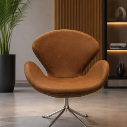 Luxury Swan Lounge Chair for Reception, Hotel Lobby & Premium Lounge Spaces Bring timeless elegance and superior comfort to your workspace with the Luxury Swan Lounge Chair. Designed with a beautifully curved shell, premium upholstery, and a heavy-duty swivel base, this chair is an excellent choice for reception areas, executive lounges, hotel lobbies, waiting rooms, luxury offices, cafés, restaurants, salons, and modern living spaces. The chair features an ergonomically designed curved backrest with integrated arm support that comfortably embraces the body, providing exceptional support during extended sitting. The spacious seat and high-density foam cushioning help reduce fatigue while maintaining maximum comfort throughout the day. Upholstered in premium-quality leatherette, the chair offers a soft-touch finish that is durable, easy to clean, and resistant to daily wear and tear. The elegant brown color enhances both contemporary and classic interiors, making it a stylish addition to commercial and residential environments alike. Its distinctive swan-inspired silhouette adds sophistication while offering excellent lumbar and arm support. Whether placed in a corporate reception, luxury hotel lobby, designer office, or executive waiting area, this chair creates an inviting atmosphere for clients and guests. The chair is supported by a heavy-duty polished stainless steel four-star swivel base that provides exceptional stability and smooth 360-degree rotation. Built for commercial use, the robust construction ensures long-lasting durability while maintaining a sleek and premium appearance. Combining modern aesthetics with ergonomic functionality, the Luxury Swan Lounge Chair is manufactured using high-quality materials and precision craftsmanship. It is the perfect seating solution for businesses looking to create elegant, comfortable, and professional interiors. Whether furnishing a luxury reception area, executive office, premium café, hotel lounge, or modern home, this chair delivers outstanding comfort, refined styling, and reliable performance for years to come. Key Features Premium Leatherette Upholstery Elegant Swan-Inspired Design Ergonomic Curved Backrest High-Density Foam Cushioning Integrated Armrests 360° Swivel Function Heavy-Duty Stainless Steel Base Commercial Grade Construction Comfortable for Long Sitting Modern Luxury Appearance Easy to Clean Surface Suitable for Residential & Commercial Use SEO Keywords Luxury Lounge Chair, Swan Chair, Reception Chair, Swivel Lounge Chair, Visitor Chair, Waiting Room Chair, Hotel Lobby Chair, Executive Lounge Chair, Premium Reception Chair, Designer Office Chair, Modern Lounge Seating, Commercial Lounge Chair, Office Reception Furniture, Luxury Office Chair, Hospitality Seating