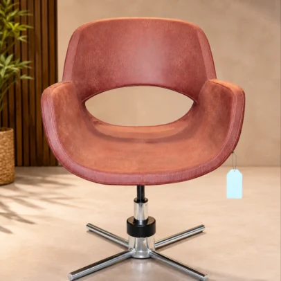 The Premium Designer Swivel Lounge Chair is crafted for customers who appreciate modern aesthetics and superior comfort. Upholstered in premium-quality leatherette with high-density foam cushioning, this chair provides exceptional seating comfort for extended periods. Its distinctive curved backrest with an open-back design creates a premium contemporary look while ensuring ergonomic support. The smooth 360° swivel mechanism allows effortless movement, making it perfect for reception areas, executive offices, meeting rooms, cafés, restaurants, hotel lobbies, luxury lounges, and stylish residential interiors. The heavy-duty chrome metal star base offers outstanding stability, corrosion resistance, and long-lasting durability. Designed for both commercial and residential environments, this chair blends luxury, comfort, and performance in one elegant package. Product Specifications Frame Material: Heavy-Duty Metal Frame Base Material: Chrome-Plated Steel Star Base Upholstery Material: Premium Leatherette Seat Material: High-Density Foam Cushion Armrest: Integrated Upholstered Armrests Backrest: Ergonomic Curved Open Back Swivel: 360° Rotation Color: Brown Style: Modern Luxury Assembly: Easy Assembly Usage: Indoor Key Features ✔ Premium Leatherette Upholstery ✔ Ergonomic Curved Backrest ✔ Modern Open-Back Designer Style ✔ Smooth 360° Swivel Function ✔ Heavy-Duty Chrome Metal Base ✔ Comfortable Armrests ✔ High-Density Foam Seat ✔ Strong Metal Construction ✔ Scratch & Rust Resistant Base ✔ Elegant Luxury Finish ✔ Easy Maintenance ✔ Ideal for Commercial & Residential Spaces Applications Office Reception Executive Cabin Hotel Lobby Waiting Area Café Restaurant Lounge Meeting Room Living Room Luxury Apartment Studio Commercial Interiors SEO Keywords Swivel Lounge Chair, Designer Lounge Chair, Leather Lounge Chair, Modern Lounge Chair, Reception Chair, Visitor Chair, Waiting Chair, Luxury Accent Chair, Office Lounge Chair, Hotel Lobby Chair, Café Chair, Restaurant Chair, Contemporary Chair, Leatherette Chair, Swivel Accent Chair, Premium Lounge Seating, Commercial Lounge Chair, Designer Office Chair, Modern Furniture India, Luxury Furniture