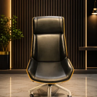 Premium High Back Executive Office Chair for Modern Workspaces Upgrade your workspace with the Premium High Back Executive Office Chair, designed to deliver exceptional comfort, professional style, and long-lasting durability. Crafted for executives, business professionals, managers, and home office users, this chair combines elegant aesthetics with ergonomic support to create a comfortable seating experience throughout the workday. The chair features a high-back executive design that provides excellent support for the back, shoulders, and neck while maintaining proper sitting posture. Its premium cushioned seat and backrest help reduce fatigue during long working hours, making it an ideal choice for corporate offices, executive cabins, conference rooms, director cabins, and premium home offices. Upholstered in high-quality premium leatherette, the chair offers a sophisticated appearance that enhances the professional look of any workspace. The smooth stitched finish, elegant contours, and modern design make it a perfect addition to contemporary office interiors. Designed for everyday performance, the chair includes a durable heavy-duty metal base with smooth-rolling caster wheels that provide effortless mobility across different flooring surfaces. The 360-degree swivel mechanism allows users to move freely without leaving their seat, increasing productivity and convenience during daily tasks. The generously padded seat is engineered with high-density foam to provide lasting comfort while maintaining its shape even after extended use. The ergonomically designed backrest supports the natural curve of the spine, helping reduce pressure on the lower back and improving sitting posture. Built using premium-quality materials, this executive office chair offers excellent stability, durability, and reliable performance in demanding office environments. Whether used for meetings, computer work, administration, or executive decision-making, this chair delivers the comfort and style professionals expect. Its luxurious appearance, premium upholstery, and modern construction make it suitable for corporate offices, startups, boardrooms, private cabins, reception offices, and commercial workspaces. The elegant design complements a wide range of office furniture and interior styles. If you are looking for a stylish, comfortable, and durable executive office chair that combines premium quality with ergonomic support, this model is an excellent choice. It is designed to enhance workplace comfort, improve productivity, and create a sophisticated office environment. Choose the Premium High Back Executive Office Chair to experience superior seating comfort, exceptional craftsmanship, and professional elegance for years to come. Key Features Premium High Back Executive Design Ergonomic Back Support Soft Cushioned Seat & Backrest Premium Leatherette Upholstery Heavy-Duty Metal Base 360° Swivel Function Smooth Rolling Castor Wheels Strong & Durable Construction Elegant Modern Design Comfortable for Long Working Hours Suitable for Corporate Offices Easy Maintenance Surface SEO Keywords Executive Office Chair High Back Executive Chair Premium Office Chair Luxury Office Chair Boss Chair Office Chair Ergonomic Executive Chair Revolving Office Chair Swivel Office Chair Director Office Chair Corporate Office Chair Leather Office Chair High Back Chair Office Furniture Executive Seating