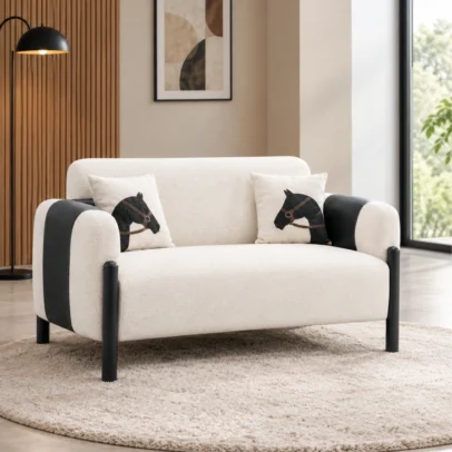 Modern two-seater sofa with cream upholstery and black accents Cream modern sofa with black legs for contemporary interiors Two-seater sofa with textured cream upholstery and black side detailing Modern sofa furniture by Global Star Furniture in Ghaziabad Contemporary cream sofa with black cylindrical legs and cushions