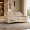 Modern cream fabric two seater sofa with wooden legs Cream contemporary sofa with plush back and seat cushions Modern fabric sofa for home apartment and lounge Cream sofa with smooth arms and wooden legs Modern cream sofa from Global Star Furniture Ghaziabad
