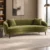 Modern olive green curved fabric sofa with tapered legs Olive green modern sofa with soft fabric upholstery Curved fabric sofa for modern living room Modern curved sofa with smooth seat finish and tapered legs Premium fabric sofa from Global Star Furniture Ghaziabad