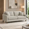 Modern fabric sofa with wooden legs Light neutral upholstered sofa with cushions Modern living room sofa with elegant armrests Contemporary fabric sofa by Global Star Furniture Modern sofa manufacturer in Ghaziabad with wooden legs