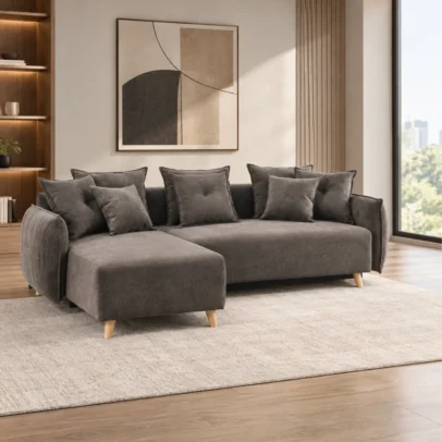 Modern sectional sofa design Integrated chaise / extended seating section Dark grey fabric upholstery Subtle textured upholstery appearance Spacious seating configuration Multiple layered cushions Button-detail cushion visible Rounded armrest design Clearly defined chaise construction Natural wood-toned tapered legs Contemporary residential appearance Suitable for living rooms and lounge areas