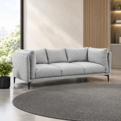 Modern 3 seater sofa design Light grey fabric upholstery Soft fabric appearance Plush cushioning Multiple back cushions Individual seat cushions Refined edge detailing Sleek metal legs Contemporary silhouette Spacious seating arrangement Neutral colour suitable for modern interiors Designed for living rooms, lounges and modern homes