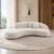 Modern curved fabric sofa in cream colour Contemporary curved sofa with rounded backrest Cream upholstered modern sofa with cushions Modern curved living room sofa by Global Star Furniture Contemporary fabric sofa manufacturer in Ghaziabad