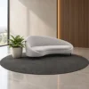 Modern curved upholstered sofa in light grey Contemporary curved sofa with sculptural backrest Light grey modern sofa with slim dark legs Curved living room sofa by Global Star Furniture Modern upholstered sofa manufacturer in Ghaziabad