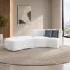 Modern curved modular sofa with chaise in white upholstery Contemporary white sofa with curved chaise section Modern modular living room sofa with checked cushions Curved upholstered sofa by Global Star Furniture Modern modular sofa manufacturer in Ghaziabad